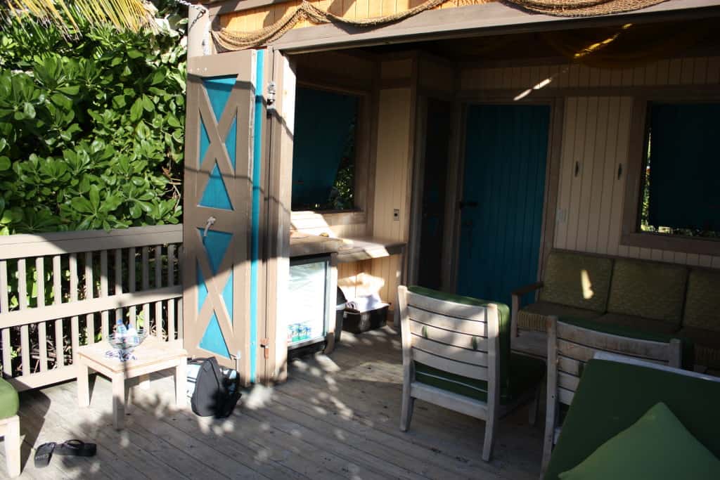 Left side with refrigerator, snacks, and towels