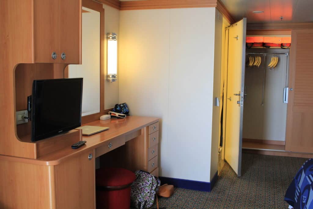 Looking at bathroom/desk from end of bed