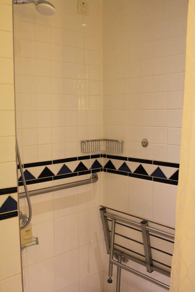 Shower with folding bench
