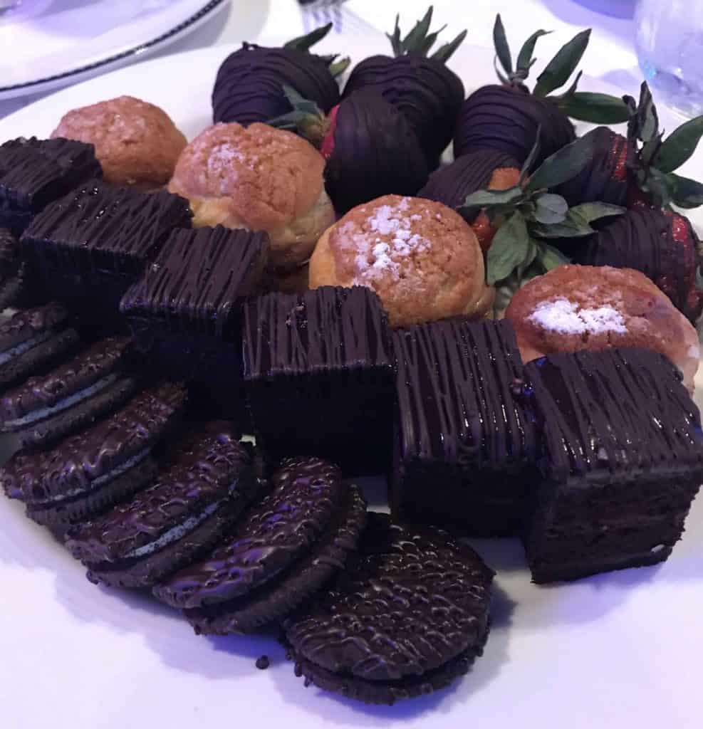 Chocolate covered brownies, cookies, strawberries and creme puffs