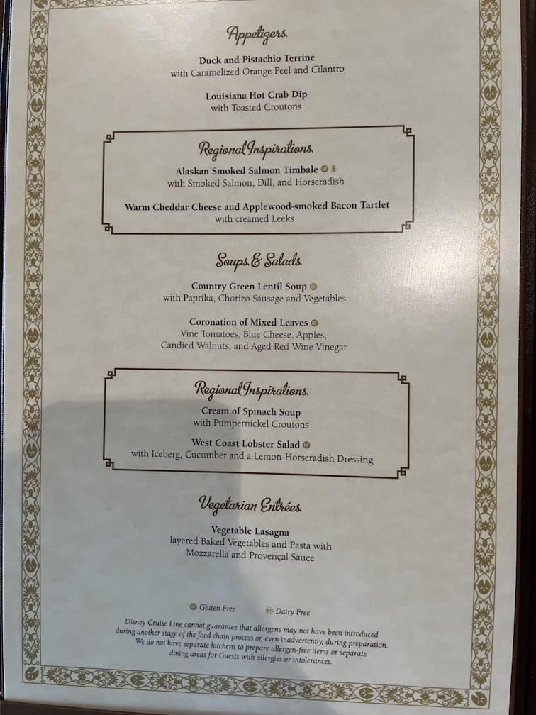 Dinner menu from Disney Wonder featuring appetizers, soups, salads, and vegetarian entrees, including Louisiana Hot Crab Dip and West Coast Lobster Salad.