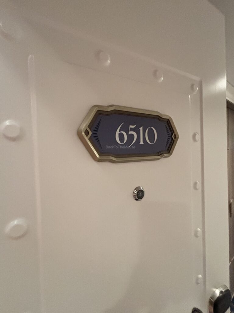 Door of stateroom 6510 on the Disney Destiny, featuring the room number plaque.