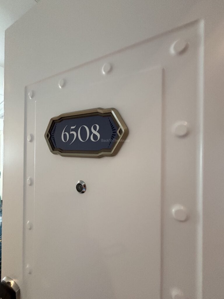 Close-up view of the door to Stateroom 6508 on the Disney Destiny, featuring the room number sign and door details.